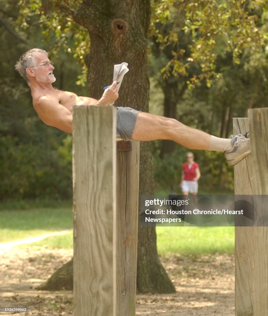 9 21 04 Bobby Younce Does A Crossword Puzzle As He Uses The News Photo Getty Images